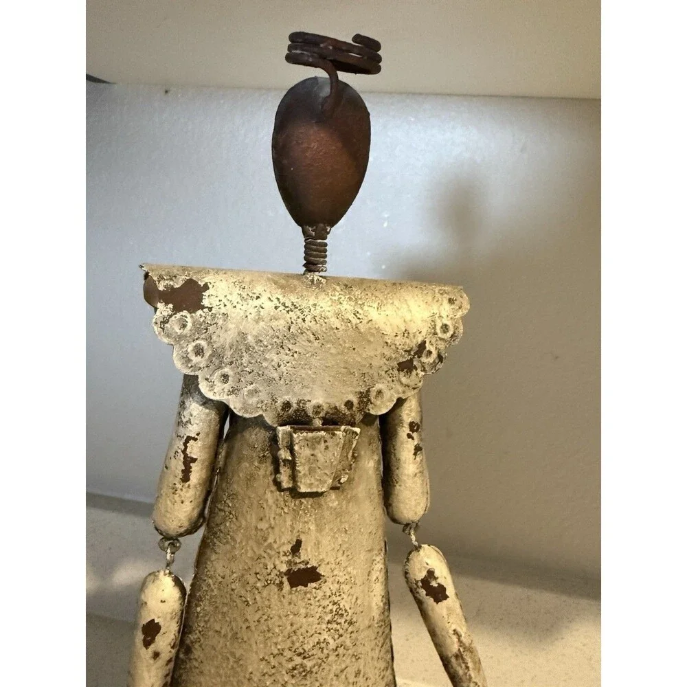 VTG decorative rustic metal sculpture of a stylized figure holding a large key.
